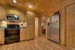 Large Kitchen with a electric appliances and bar seating for two 
